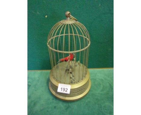 Modern antique style Automonial bird cage with 1 bird enclosed playing musical tune 10.5" tall 5.5" wide, a well made antique