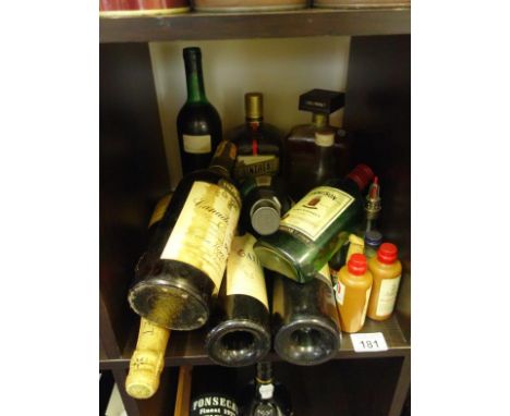 Small collection of miniatures, single litre bottle of Cointreau, single bottle of Amaretto, a bottle of Moet Chandon, non vi