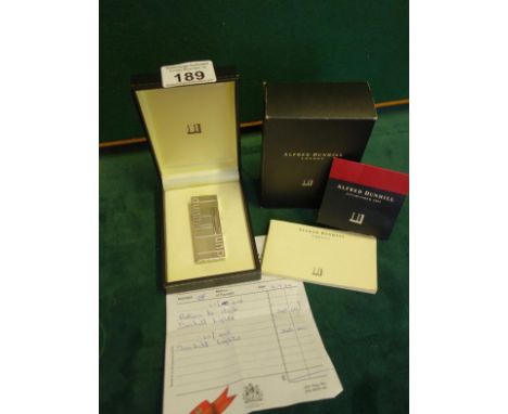 Alfred Dunhill, a silver coloured Gentleman's lighter with original purchase receipt with packing instructions and spare flin