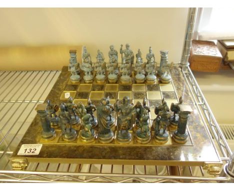 Modern chess set, cold panted brass ware, each figure modelled as Roman Warriors a complete set, the King & Queen measure 3.5