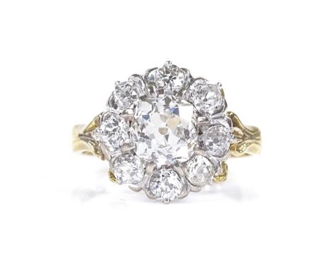 An 18ct gold diamond cluster ring, central old mine-cut diamond measures 6.85mm x 6.62mm x 4.53mm, surrounded by 8 old-cut di