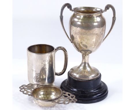 A silver 2-handled trophy on stand, silver tea strainer, and silver christening mug, 6.3oz weighable (3) 