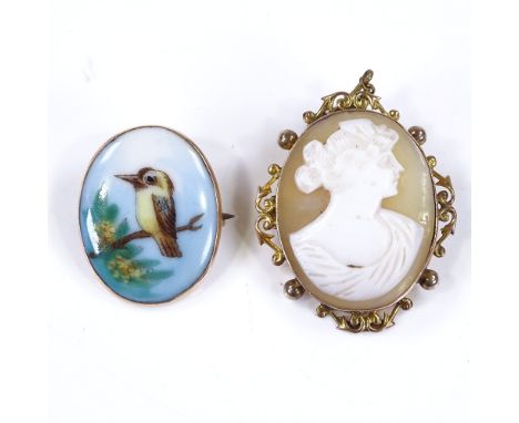 A painted porcelain panel brooch, depicting a Kookaburra, in 9ct frame, height 27mm, together with a relief carved cameo pane
