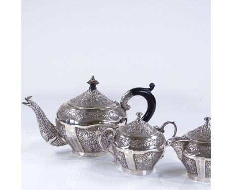 An Indian/Burmese unmarked silver 3-piece tea set, with all over relief embossed leaf decoration, teapot height 16cm, 36oz to