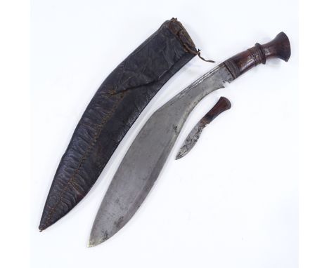 A Second War Period Gurkha kukri knife, original leather scabbard, missing one small knife 