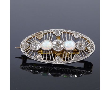 A Belle Epoque style unmarked gold opal and diamond oval brooch, with openwork settings, length 28.6mm, 4.4g 