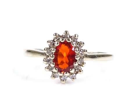 A 9ct gold fire opal and diamond cluster ring, setting height 9.9mm, size L, 2.1g 