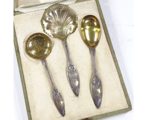 A 19th century French silver strawberries and cream set, comprising strawberry spoon, cream ladle, and sifter spoon, with cas