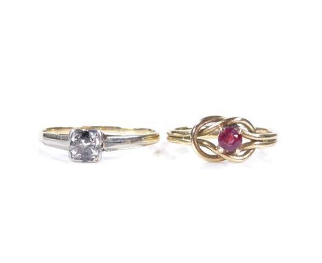 An unmarked gold 0.25ct solitaire diamond ring, setting height 4.8mm, size N, 1.6g, together with a 9ct gold ruby knot ring, 