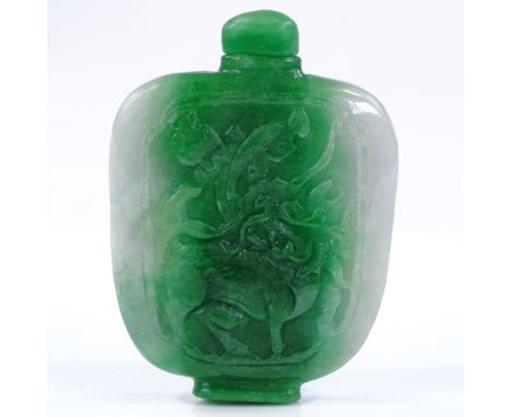 A Chinese relief carved jade snuff bottle and stopper, height 7cm 