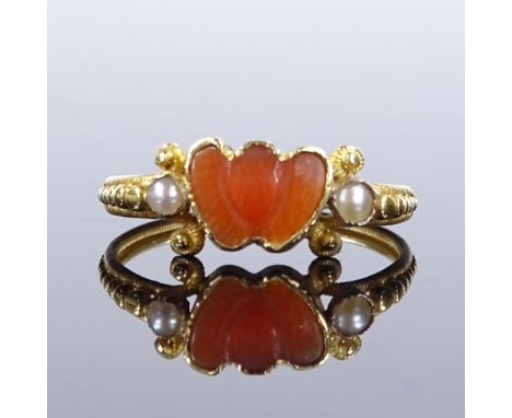 A Georgian unmarked gold carved coral and split-pearl double-heart ring, with milled shank, setting height 6.7mm, size L, 1.3