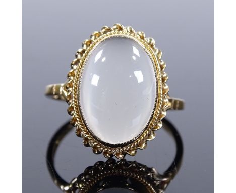 A 9ct gold cat's eye cabochon moonstone ring, with rope twist surround, setting height 17.6mm, size O, 2.9g 