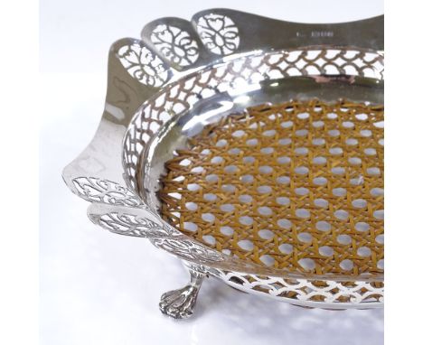 A circular silver fruit bowl, with central wicker panel and pierced rim, by Charles Alfred Alston, hallmarks London 1926, dia