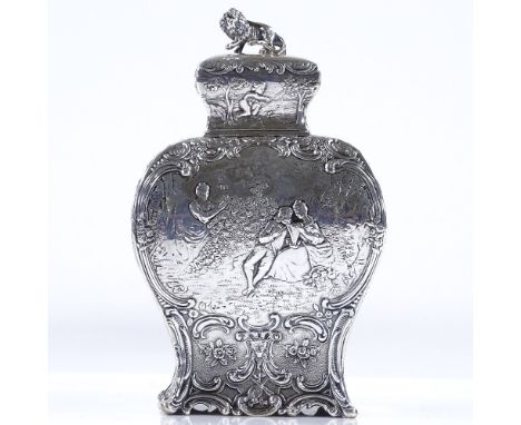 A 19th century French silver tea caddy, of rectangular baluster form, with relief embossed lover scenes, within a foliate and