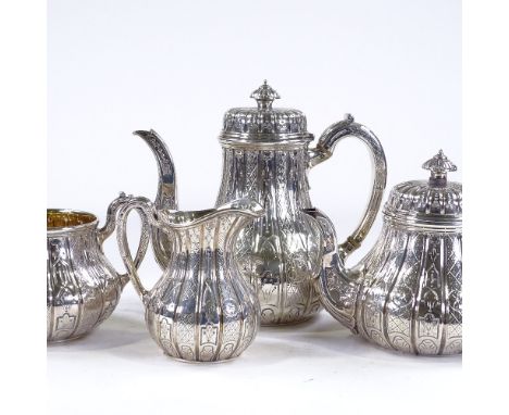 A fine quality Victorian 4-piece silver tea and coffee set, with engraved and relief embossed panel decoration, and ivory ins