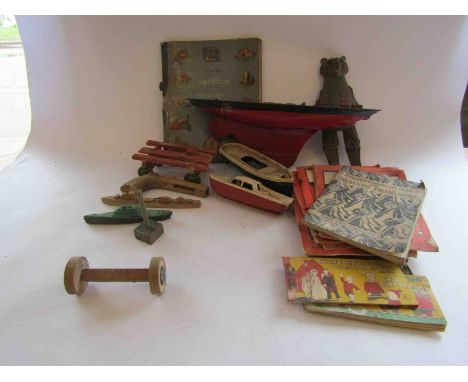 Two Penguin plastic clockwork boats and another tinplate boat together with other mixed vintage toys and childrens books