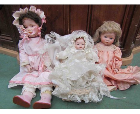 three bisque headed dolls, two on jointed bodies, to include Kammer &amp; Reinhart, 'Sheer Elegance' and Sankyo