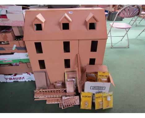 A large unpainted three storey dolls house, approx. 87cm tall, together with a bag containing wooden staircase, doors etc and