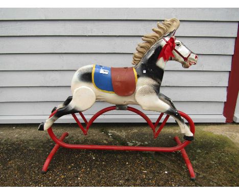 A vintage metal rocking horse