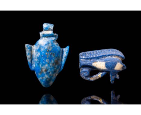 New Kingdom, Ca. 1550 - 1069 BC. A pair of amulets consisting of a lapis lazuli heart vessel and a faience Wedjat eye. The he