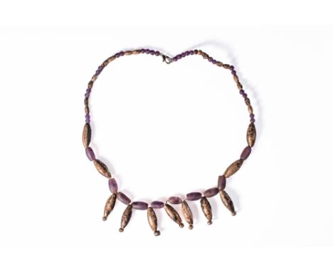 Late Period, Ca. 664 - 332 BC. A restrung necklace consisting of alternating amethyst and silver beads, with the central sect