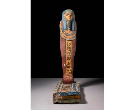 New Kingdom, XX Dynasty, Ca. 1185 BC.An Egyptian ushabti depicted in a mummiform style, standing upright on an integral recta
