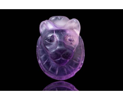 Late Period, Ca. 664 - 332 BC. A head of Sekhmet carved from amethyst. The lioness features are rendered with rounded ears, a