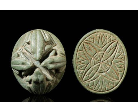 Third intermediate Period, Ca. 1069 - 664 BC.A stone seal with four sculpted frogs symmetrically arranged on the upper surfac