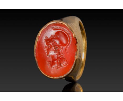 Ca. 100 BC - AD 100. A large and oval carnelian intaglio engraved with a left-facing bust of Minerva, wearing her iconic cres