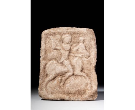 Ca. 400 - 300 BC. A marble stele carved in low relief with a scene of a Thracian horseman advancing right, his right hand rai
