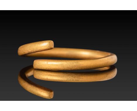 Ca. AD 1 - 300. A gold hair ring with a plain circular band formed from a solid round-sectioned rod.Size: D:16.1mm / US: 5 1/