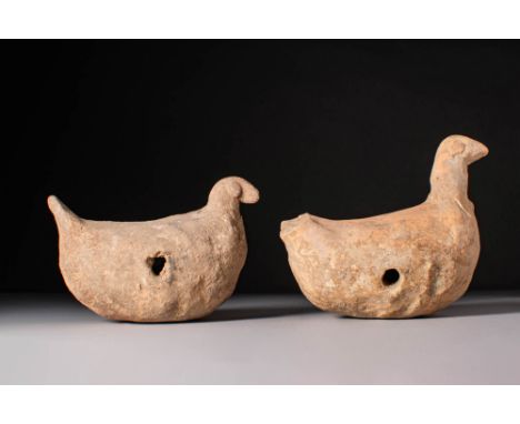 Predynastic Period, Ca. 4600 - 4100 BC. A pair of terracotta bird figurines with rounded, bulbous bodies, small protruding ta