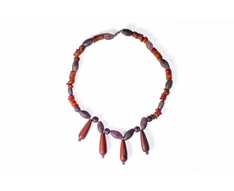 Late Period, Ca. 664 - 332 BC. A restrung strand composed of barrel-shaped amethyst segments alternating with clusters of car