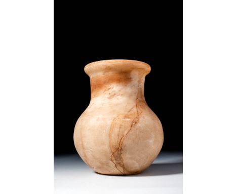 New Kingdom, Ca. 1550 - 1069 BC. A globular alabaster vessel with a broad cylindrical neck and everted, rounded rim. The ston