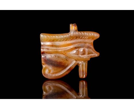 Late Period, Ca. 664 - 332 BC. A carnelian Wedjat eye amulet, carved in the form of the Eye of Horus with well-defined detail