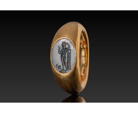 Ca. AD 1 - 300. An oval green jasper intaglio engraved with a standing figure of Mars, shown nude and facing left, leaning ag