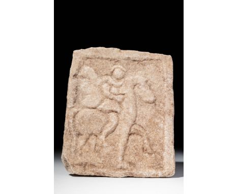 Ca. 400 - 300 BC. A marble stele carved in low relief with a scene of a Thracian horseman advancing right. The rider wears a 