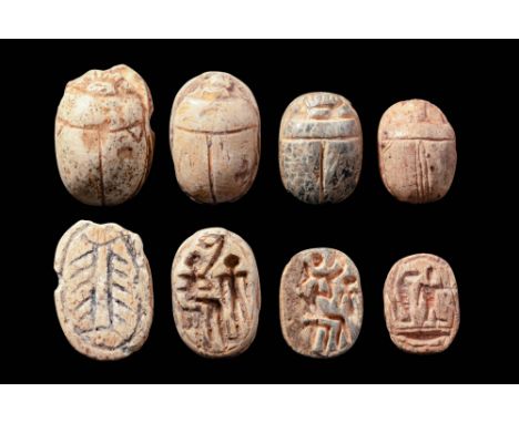 New Kingdom to Late Period, Ca. 1550 - 332 BC. A collection of four steatite scarabs, each carved with a domed back and detai