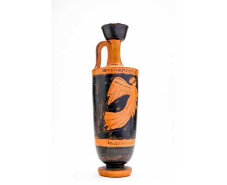 Ca. 450 BC. A Greek red figure Lekythos of slender form with rounded shoulders tapering to a narrow foot, the vessel is surmo