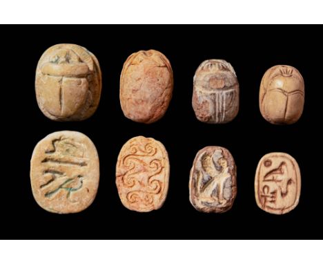 Second Intermediate Period, Ca. 1790 - 1550. A collection of four scarabs. The one on the left is the largest, with a detaile