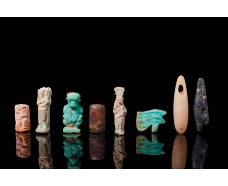 Third Intermediate Period - Late Period, Ca. 1069 - 332 BC. A collection of eight faience and stone amulets. The first on the