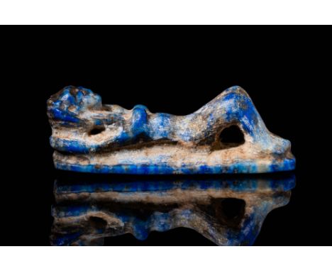 Ca. 664 . 30 BC. A lapis lazuli amulet in the form of a reclining female figure. Her elongated body is sculpted with defined 