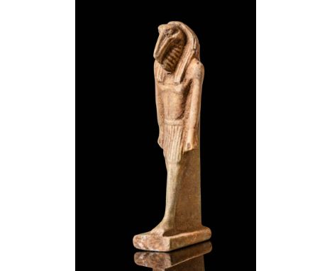 Late Period, Ca. 664 - 332 BC. A faience amulet of Thoth depicted standing with a striding posture, wearing a short kilt with