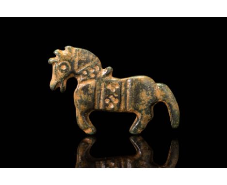Ca. AD 200 - 500.A bronze brooch in the form of a stylised horse depicted in profile with clearly delineated legs, arched nec
