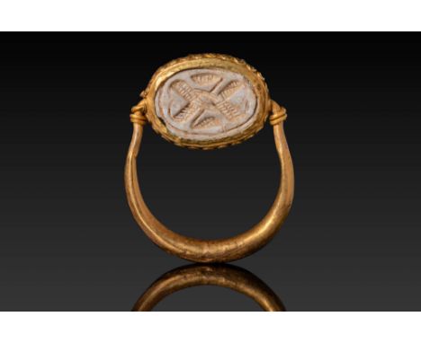 New Kingdom, Ca. 1550 - 1069 BC. A steatite scarab engraved on the underside with a symmetrical pattern of interwoven element