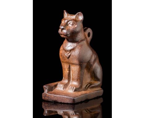Ca. 300 - 100 BC. A hard stone amulet in the form of a seated cat, depicted with upright ears, a rounded muzzle, and large, a