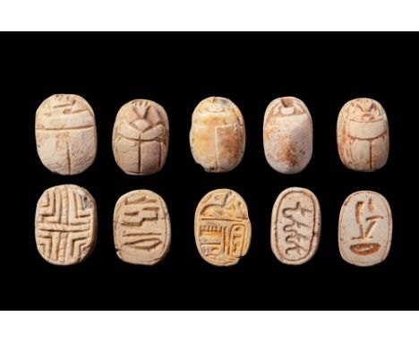 New Kingdom, Ca. 1550 - 1069 BC. A collection of six steatite scarabs, each carved with detailed anatomical features on the d