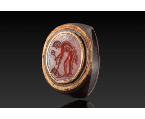 Ca. 100 BC - AD 50 .A carnelian intaglio engraved with a figure of Mercury depicted in a bent posture. He is nude, with one l