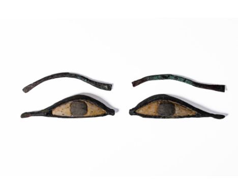 Late Period, Ca. 664 - 30 BC. A pair of eye inlays and separate bronze eyebrows. Each eye inlay is shaped with an elongated c