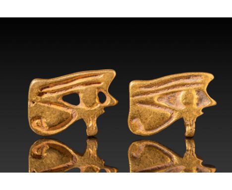 New Kingdom, Ca. 1550 - 1069 BC. A pair of gold Wadjet amulets, each finely shaped to depict the stylised Eye of Horus. The o